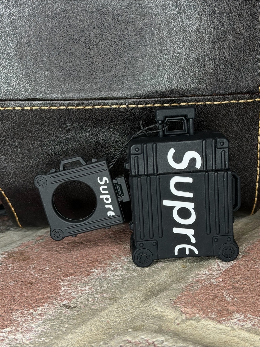 Supreme “Supre” Suitcase AirPods Luggage-Shaped